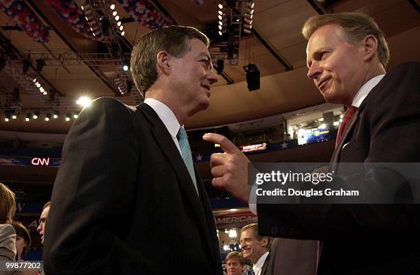 Bill Owens talks with David Dryer on the floor of the 2004 Republican National Convention in New York.