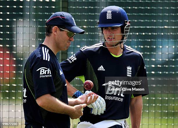 Alastair Cook of England Lions talks with coach Dene Hills during a net session at The County Ground on May 18, 2010 in Derby, England.
