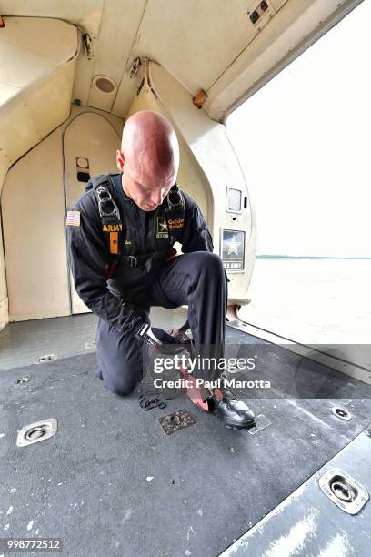 The U.S. Army Parachute Team The Golden Knights prepare for their demonstration jump at 10,500 feet at the 2018 Great New England Air and Space Show...