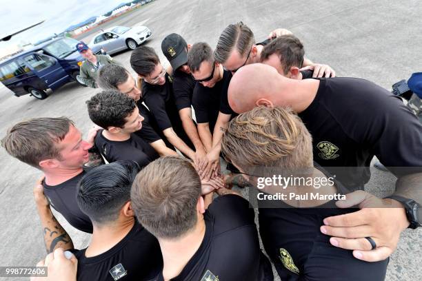 The U.S. Army Parachute Team The Golden Knights prepare for their demonstration jump at 10,500 feet at the 2018 Great New England Air and Space Show...