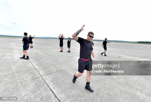 The U.S. Army Parachute Team The Golden Knights prepare for their demonstration jump at 10,500 feet at the 2018 Great New England Air and Space Show...