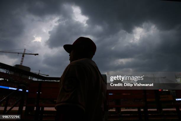 Yairo Munoz of the St. Louis Cardinals makes his way back to the clubhouse during a rain delay against the Cincinnati Reds in the first inning at...