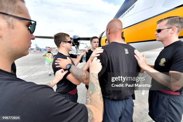 The U.S. Army Parachute Team The Golden Knights prepare for their demonstration jump at 10,500 feet at the 2018 Great New England Air and Space Show...