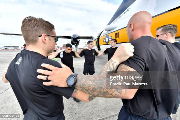 The U.S. Army Parachute Team The Golden Knights prepare for their demonstration jump at 10,500 feet at the 2018 Great New England Air and Space Show...