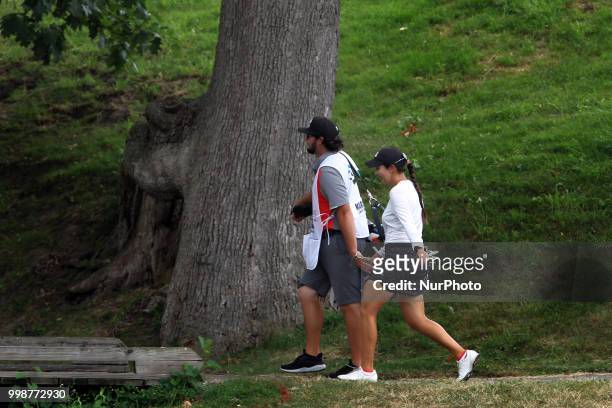 Brittany Marchand of Orangevile, Ontario walks with her caddy toward the 2nd green during the third round of the Marathon LPGA Classic golf...