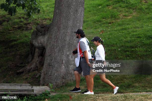 Brittany Marchand of Orangevile, Ontario walks with her caddy toward the 2nd green during the third round of the Marathon LPGA Classic golf...