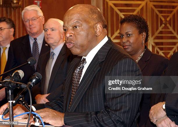 Jim Bunning, R-KY, John McCainn, R-AZ, John Lewis, D-GA, and Sharon Robinson the daughter of the late Jackie Robinson during a press conference to...