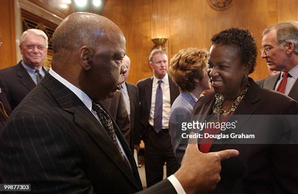 John Lewis, D-GA, talks with Sharon Robinson the daughter of the late Jackie Robinson during a press conference to push legislation to give him the...