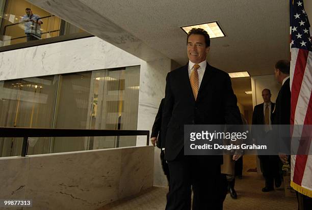 Gov. Arnold Schwarzenegger, R-Calif., walks to a closed with Dianne Feinstein, D-CA., in her office in the Hart Senate Office Building to request...