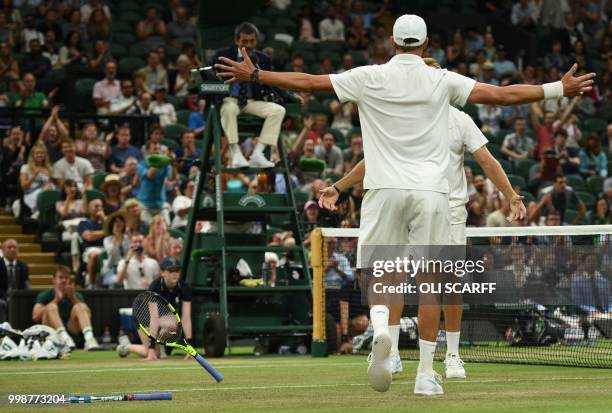 Player Mike Bryan and US player Jack Sock celebrate after beating South Africa's Raven Klaasen and New Zealand's Michael Venus 6-3, 7-6, 6-3, 5-7,...