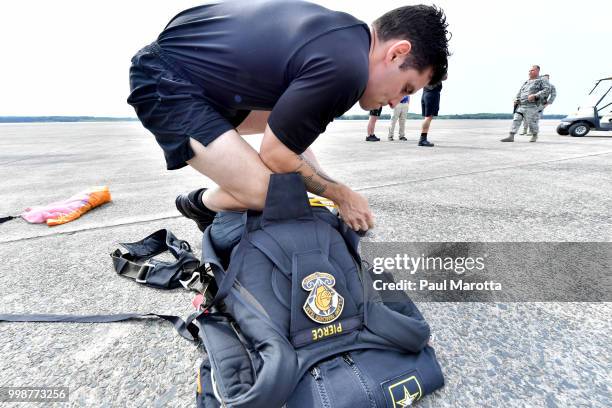 The U.S. Army Parachute Team The Golden Knights prepare for their demonstration jump at 10,500 feet at the 2018 Great New England Air and Space Show...