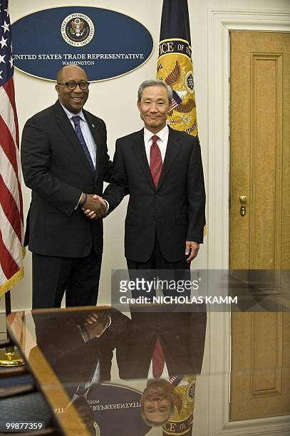 Trade Representative Ron Kirk shakes hands with South Korean Trade Minister Kim Jong-hoon before talks at the Trade Representative's office in...
