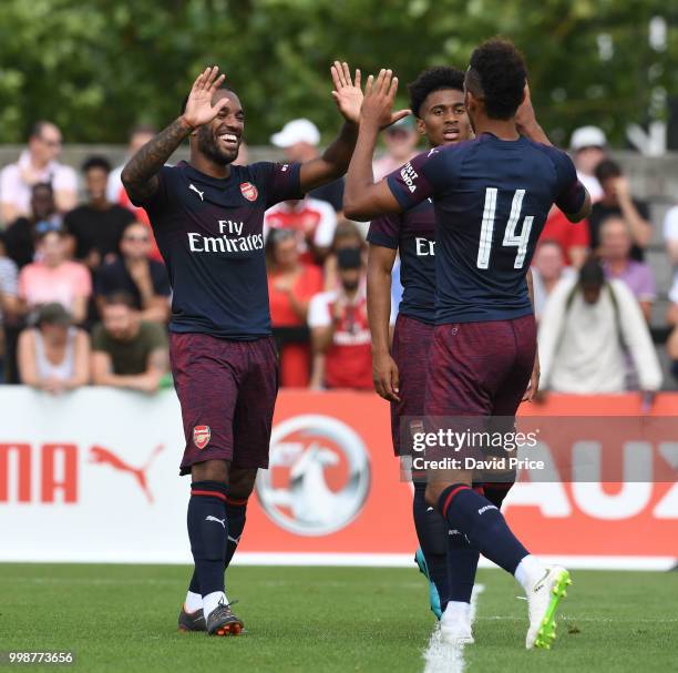 Alexandre Lacazette celebrates scoring a goal for Arsenal with Pierre-Emerick Aubameyang during the match between Borehamwood and Arsenal at Meadow...