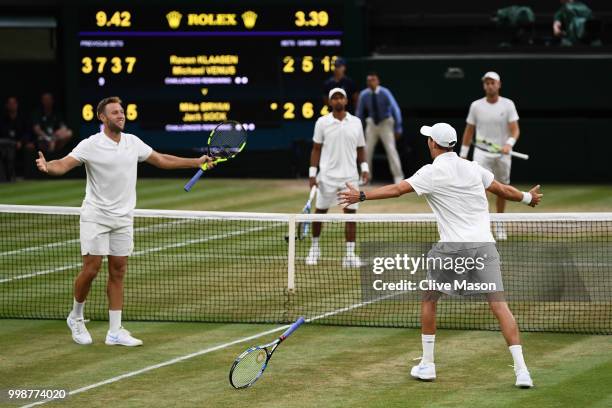 Mike Bryan and Jack Sock of The United States celebrate their victory against Raven Klaasen of South Africa and Michael Venus of New Zealand after...