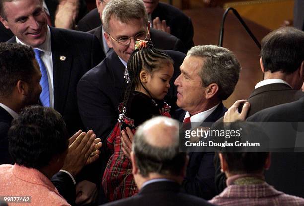 President George W. Bush greets Jessica Jackson, daughter of Jesse L. Jackson Jr., D-Il., before his State of the Union address. Jessica is 3 years...