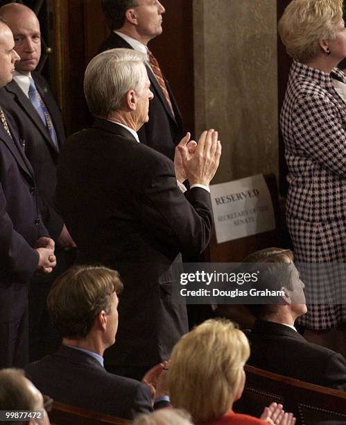 Zell Miller, D-GA., applauds President Bush as other Democrats remain seated and stoic during his State of the Union address. Bush was at that moment...