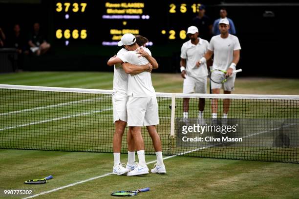 Mike Bryan and Jack Sock of The United States celebrate their victory against Raven Klaasen of South Africa and Michael Venus of New Zealand after...