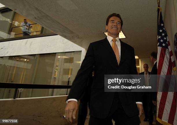 Gov. Arnold Schwarzenegger, R-Calif., walks to a closed with Dianne Feinstein, D-CA., in her office in the Hart Senate Office Building to request...