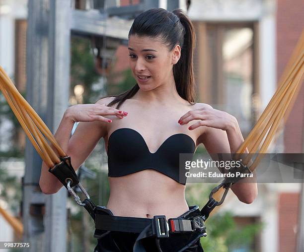 Model wearing the bra 'Perfect Strapless, designed by Wonderbra, jump on a trampoline to test the effectiveness of the new item of clothing at El...