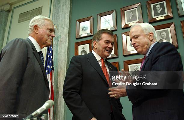 Ernest F. Hollings, D-S.C., Secretary of Homeland Security, Tom Ridge, and Johnn McCainn, R-AZ., talk before the start of the Senate Commerce,...