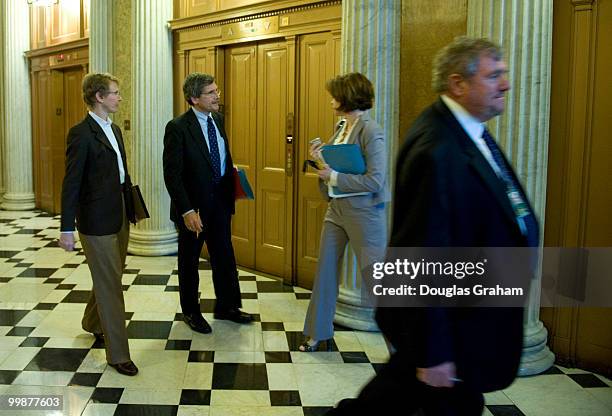 Senate Parliamentarian Alan Frumin talks with staffers outside the LBJ Room just off the House Chamber before a meeting with Democratic and...