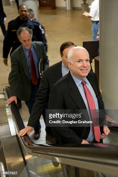 Ted Kaufman, D-DE., Richard Shelby, R-Al., and John McCain, R-AZ., on the way to the first vote of the day during the Saturday work session on the...