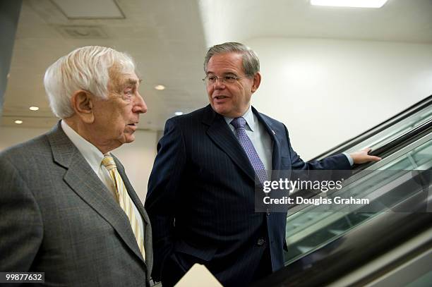 Frank Lautenberg, D-NJ., and Robert Menendez, D-NJ., talk on the way to the first vote of the day during the Saturday work session on the health care...