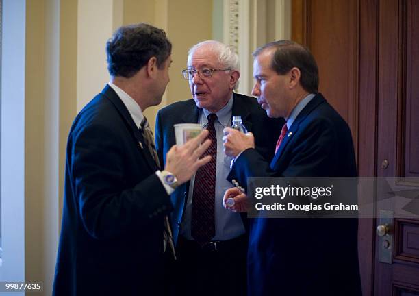 Sherrod Brown, D-OH, Bernard Sanders, I-VT, and Tom Udall, D-NM, talk just off of the Senate floor during a rare Saturday work session on the health...