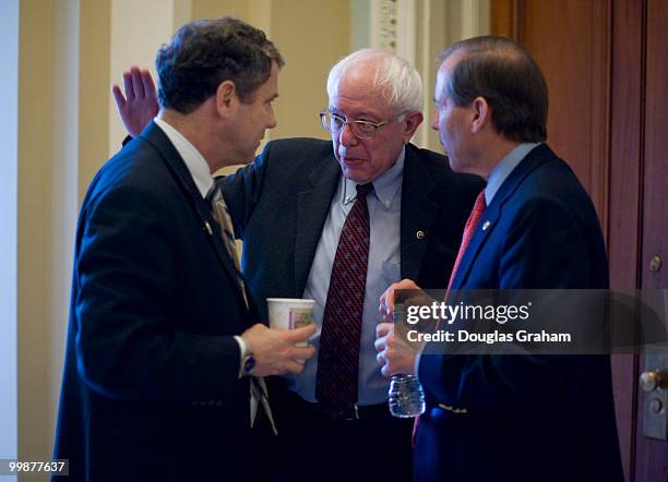 Sherrod Brown, D-OH, Bernard Sanders, I-VT, and Tom Udall, D-NM, talk just off of the Senate floor during a rare Saturday work session on the health...