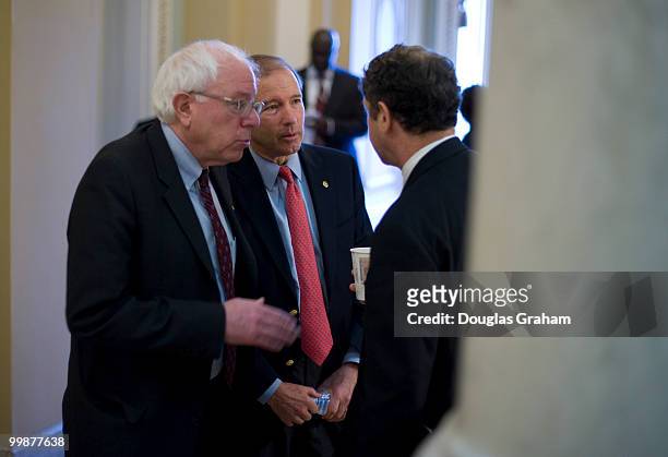 Bernard Sanders, I-VT, Tom Udall, D-NM, and Sherrod Brown, D-OH, talk just off of the Senate floor during a rare Saturday work session on the health...
