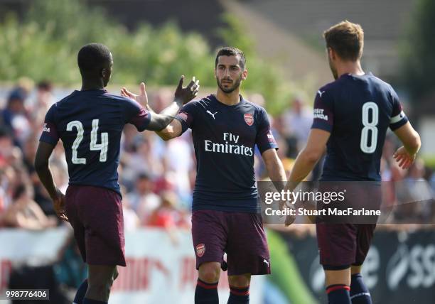 Eddie Nketiah, Henrikh Mkhitaryan and Aaron Ramsey of Arsenal during the pre-season friendly between Boreham Wood and Arsenal at Meadow Park on July...