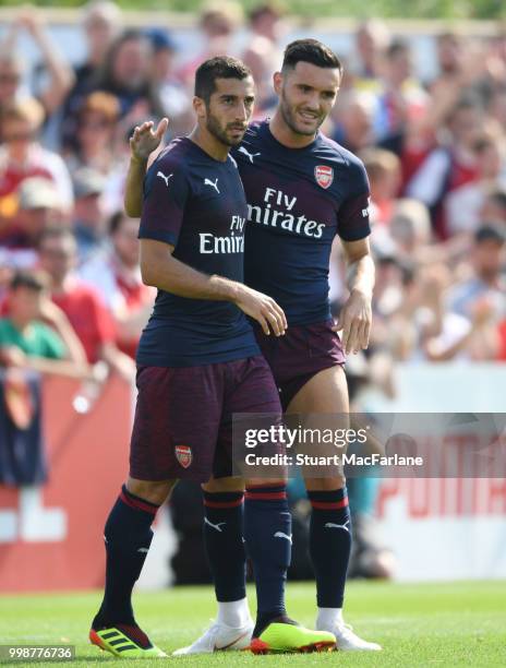 Henrikh Mkhitaryan and Lucas Perez of Arsenal smile during the pre-season friendly between Boreham Wood and Arsenal at Meadow Park on July 14, 2018...