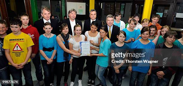 Thomas Bach , head of German Olympic Sports Association poses with children during the Children's dreams 2011 awards ceremony at the Riemenschneider...