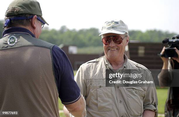 Randy "Duke" Cunningham gets a hand shake from Collin Peterson after Cunningham beat him in a speed shooting contest during the 10th Annual Great...