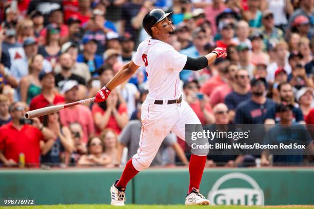 Xander Bogaerts of the Boston Red Sox hits a walk-off grand slam home run during the tenth inning of a game against the Toronto Blue Jays on July 14,...