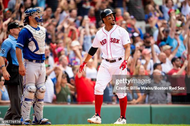 Xander Bogaerts of the Boston Red Sox reacts after hitting a walk-off grand slam home run during the tenth inning of a game against the Toronto Blue...