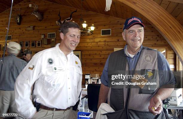 Robin Hayes tries in vain to get Jeff Crane of the Congressional Sportsmen's Foundation to do a little "mark_up" on the rules of a raffle at the 10th...