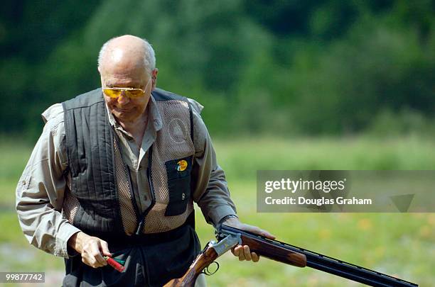 John Dingell get set up on the skeet range during the 10th Annual Great Congressional Shoot-Out at Prince George's Shooting Center in Glenn Dale,...