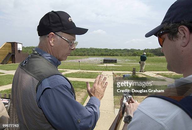 Steve Pearce gets a little advice on the aspects of shooting a double barrel shotgun from Jason Osborne during the 10th Annual Great Congressional...