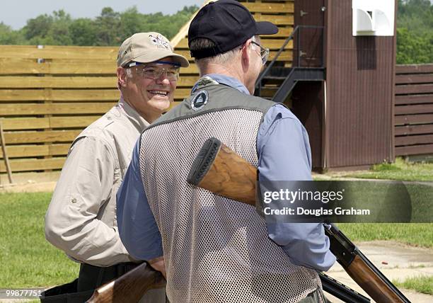 Nick Lampson talks with Steve Pearce on the trap fields during the 10th Annual Great Congressional Shoot-Out at Prince George's Shooting Center in...