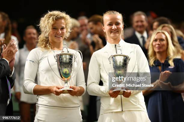 Winners Barbora Krejcikova and Katerina Siniakova of Czech Republic pose with their trophies inside Centre Court after their victory against Nicole...