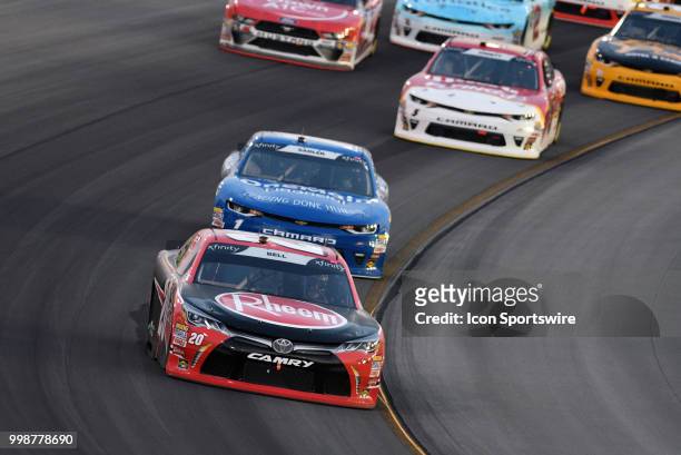 Christopher Bell Joe Gibbs Racing Toyota Camry leads a pack of cars through turn four during the NASCAR Xfinity Series Alsco 300 on July 13th at...