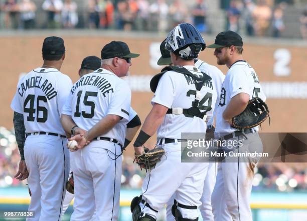 Manager Ron Gardenhire of the Detroit Tigers talks to his players on the pitchers mound during the game against the Chicago White Sox at Comerica...