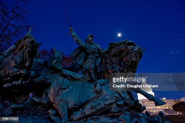 The monument to Civil War General Ulysses S. Grant sits in front of the U.S. Capitol under a full moon before the arrival of President Barack Obama...