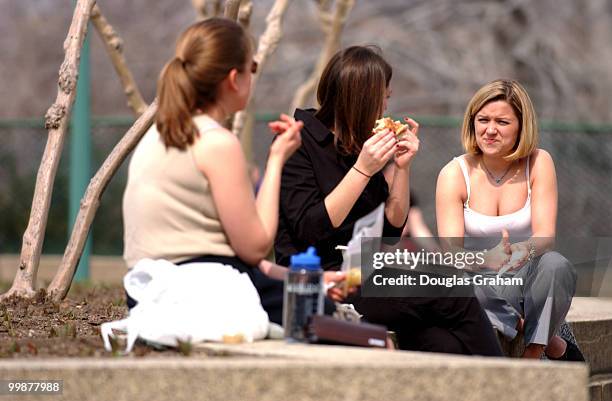 Beckey Jensen, Jennifer Wilson and Angelle Judice have lunch in the Upper Senate Park during Thursday's warm weather.
