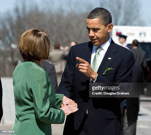 President Barack Obama talks with Speaker of the House Nancy Pelosi, D-CA before leaveing the U.S. Capitol on the East Front after the Speaker of the...