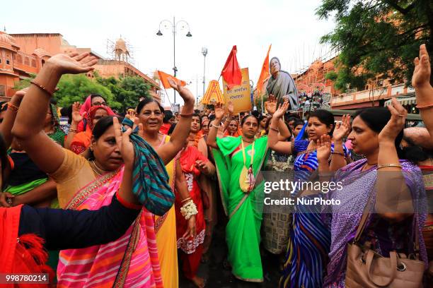 Devotees dance as others pull the chariots of Lord Jagannath during the 141st Rath Yatra at Shri Damodar Temple in Jaipur, Rajasthan, India on 14...