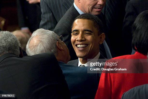 Senator Barack Obama shakes hands with congressmen and other political well wishers inside the House Chamber at the Capitol Building, Washington DC,...