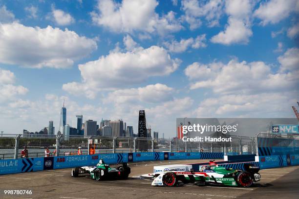 In this handout provided by FIA Formula E, Lucas Di Grassi , Audi Sport ABT Schaeffler, Audi e-tron FE04, leads Daniel Abt , Audi Sport ABT...