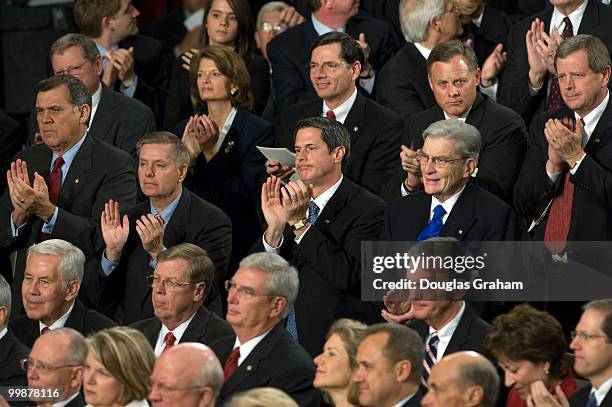 Republican members of Congress listen as President George W. Bush addresses the U.S. Congress during his State of the Union address at the U.S....